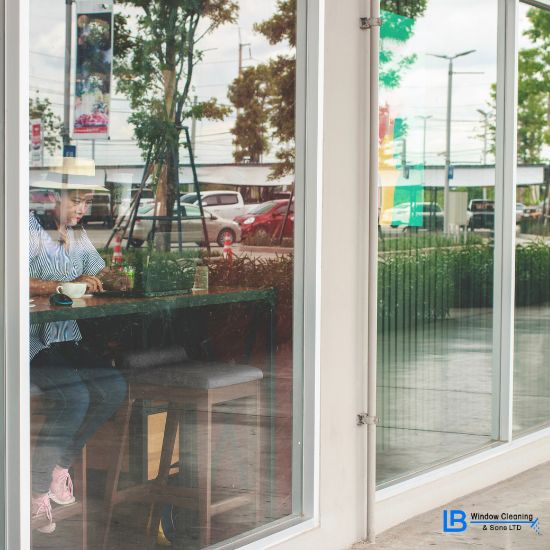 commercial business window cleaning on a shop front in stoke on trent